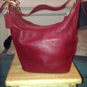 Classic medium red COACH bucket bag.